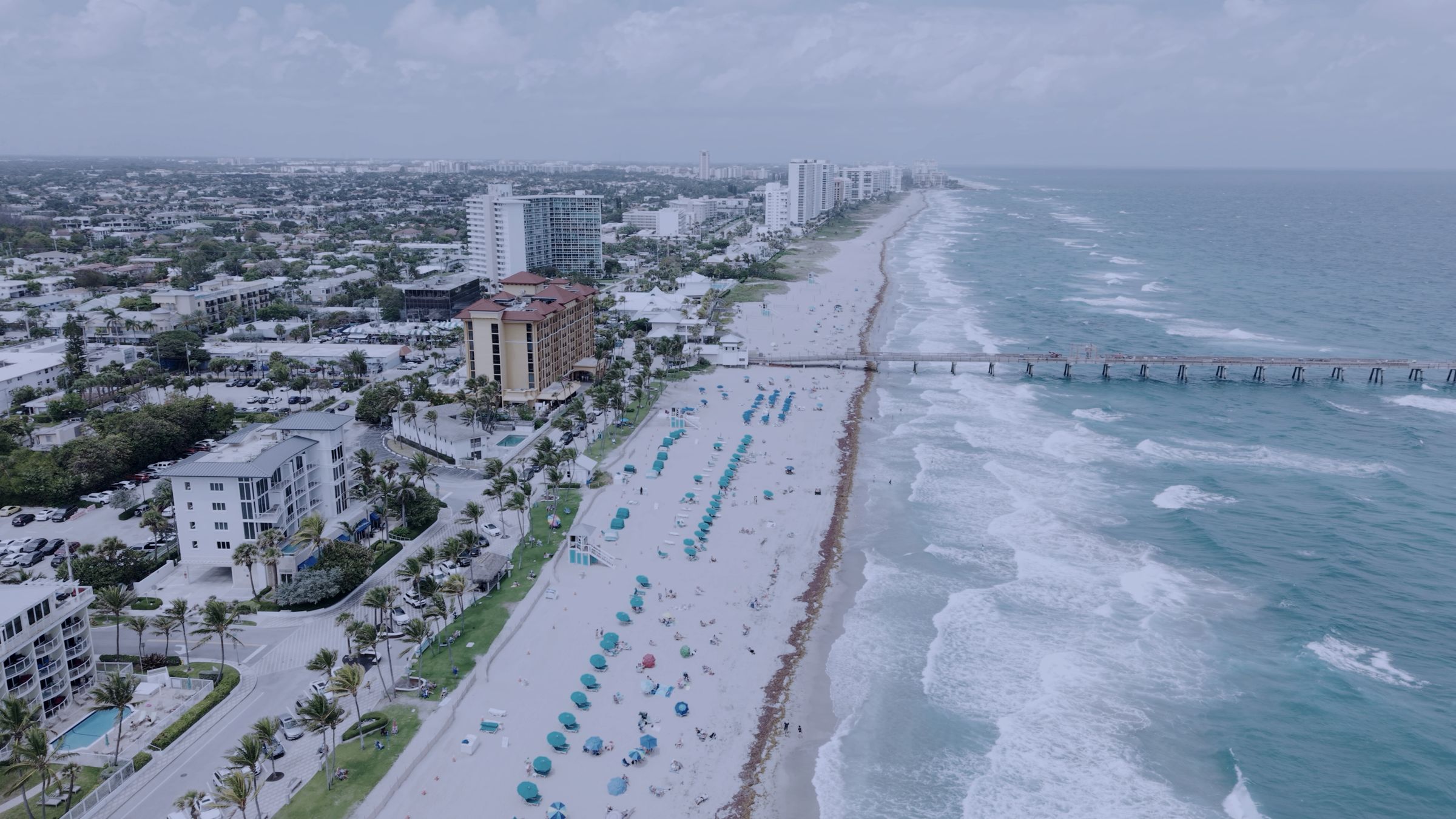 Aerial view of the Deerfield Beach, Florida shoreline and fishing pier.